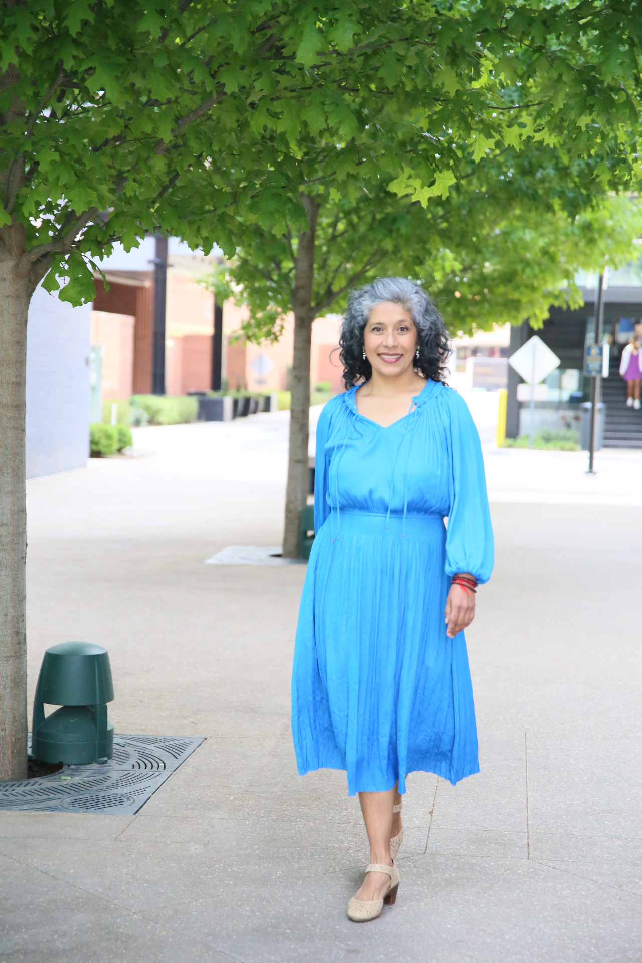 Vania Ramos Ponce walking in blue dress